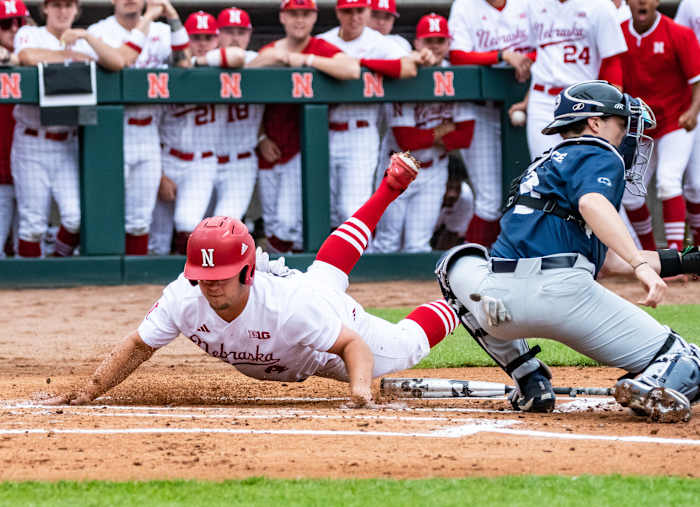 Max Anderson beats the throw to home plate on Gabe Swansen's sacrifice fly in the first inning. | Full gallery